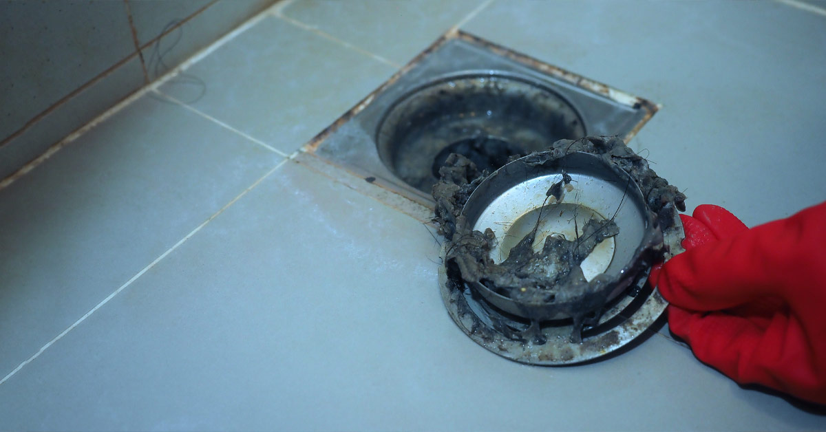Image of dirty shower drain.
